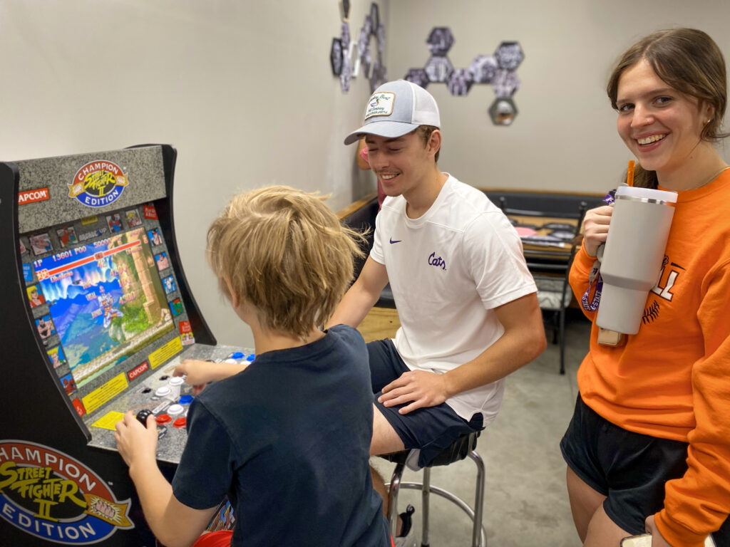 A child and adult serving together at Revolution Church